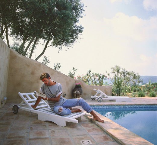 Brian Aris - George Michael, Reading by the Pool, St Tropez, 1988 - BARNBURY