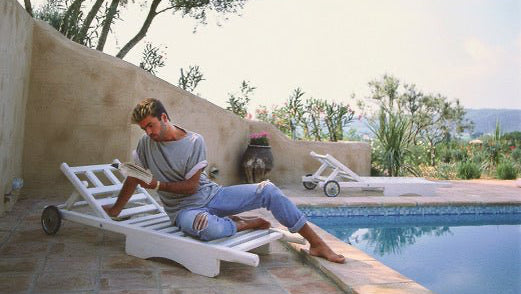 Brian Aris - George Michael, Reading by the Pool, St Tropez, 1988 - BARNBURY